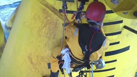Working at height and overboard using abseiling technique. Stock Footage 83605572
