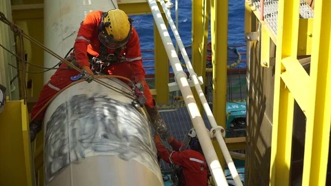 Working at height and overboard using abseiling technique. Stock-Footage 95771726