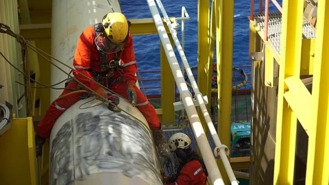 Working at height and overboard using abseiling technique. Stock Footage 95771753