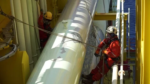Working at height and overboard using abseiling technique. Stock Footage 95777501