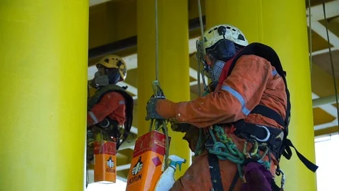 Working at height and overboard using abseiling technique. Stock Footage 104006217