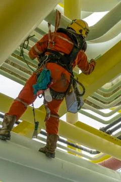 Working at height using abseiling technique. Stock Photos