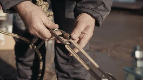 A working high-rise worker attaches a carbine to a cable Stock Footage 244735186