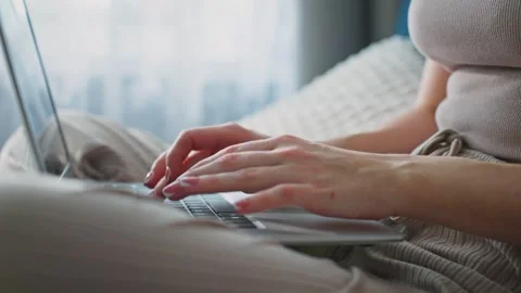 Working from home in comfortable clothing while using a laptop Stock Footage 307107642