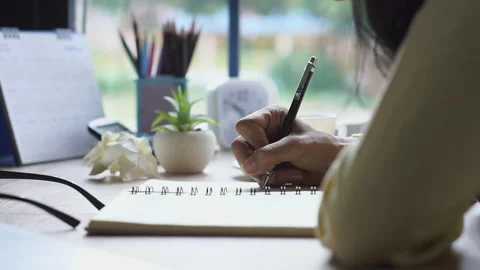 Working from home concept. Hand of Planner write timetable and daily agenda on c 库存影片 146631841