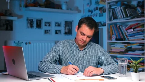 Working from Home COVID-19. Office worker doing work items at the table. Stock Footage 118673650