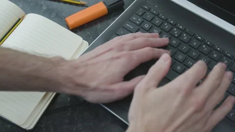Working from home hands typing fast on a laptop on kitchen counter Stockbeeldmateriaal 133809166