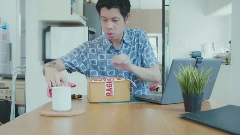 Working from Home with a Package Unboxing Experience Stock Footage 314516459