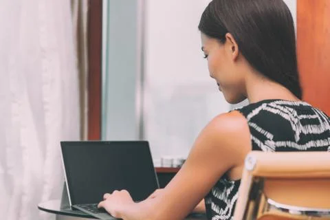 Working from home remote work freelance worker employee woman typing using Stock Photos