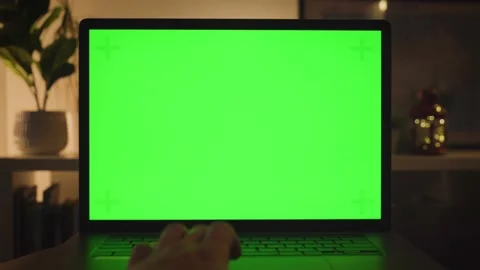 Working from home sitting on a desk working on Green Screen Laptop Stock Footage 233014218