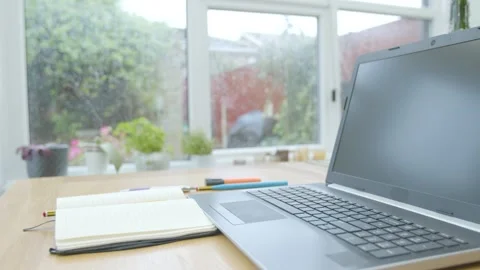 Working from home trying to think of what to write fiddling with a pencil Stockbeeldmateriaal 133811260