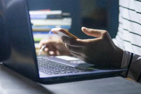 Working at home using digital tablets and mobile phones. Busy working with lapto Stock Photos