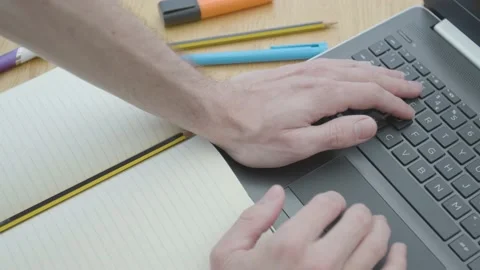 Working from home using a laptop trackpack mouse on the dinner table Stockbeeldmateriaal 133807292