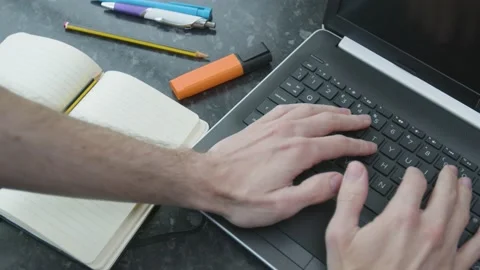 Working from home using a laptop trackpack mouse on kitchen counter Stockbeeldmateriaal 133807390