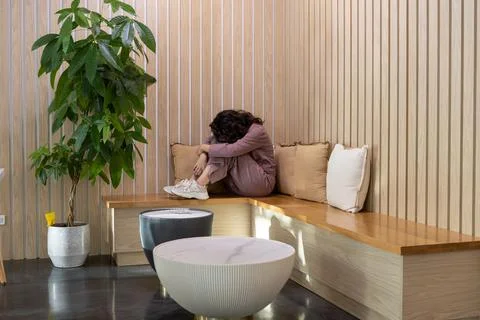 Working from home while feeling overwhelmed in a cozy corner of a modern spac Fotos Stock