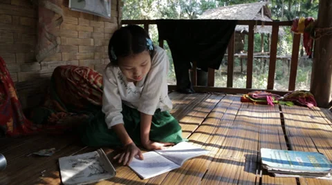 Working on Homework in Burma Stock Footage 37350735