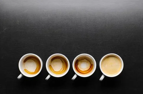 Working hours. working hours. empty and full cups of fresh espresso, view ... Stock Photos