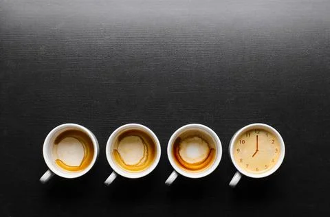 Working hours. working hours. empty and full cups of fresh espresso with c... Stock Photos