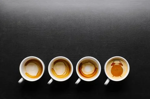 Working hours. working hours. empty and full cups of fresh espresso with c... Stock Photos