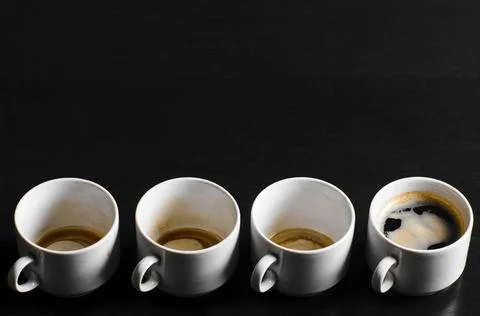Working hours. working hours. empty and full cups of fresh espresso, view ... Stock Photos
