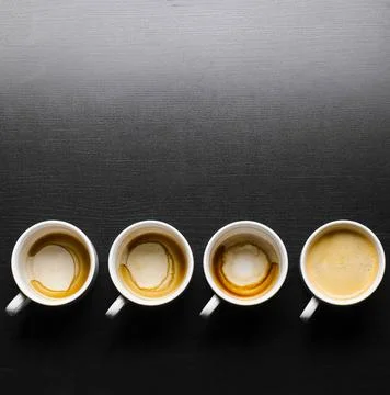 Working hours. working hours. empty and full cups of fresh espresso, view ... Stock Photos