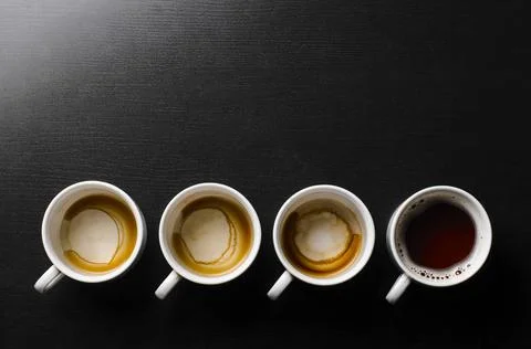 Working hours. working hours. empty and full cups of fresh espresso, view ... Stock Photos