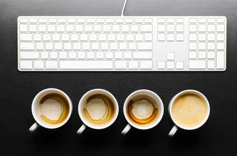 Working hours. working hours. empty and full cups of fresh espresso with k... Stock Photos