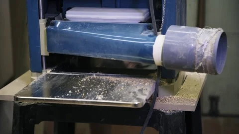 Working industrial machine of wood processing. Flying sawdust. 動画素材 72255140