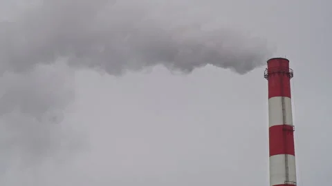 Working industrial pipe, against a gray sky, air pollution Stock Footage 154332458