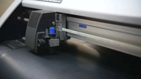 A working industrial printer cuts out Stock Footage 81049181
