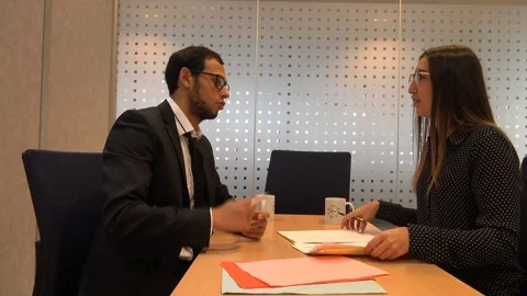 Working Interview Between Businessman and Businesswoman Stock Footage 121614780