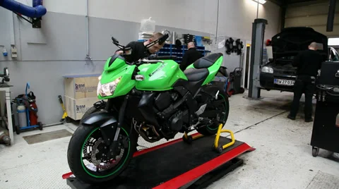 Working on a kawasaki motorcycle Stock Footage 36352170