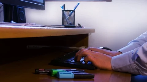 Working on Keyboard on Workdesk Stock Footage 71381794