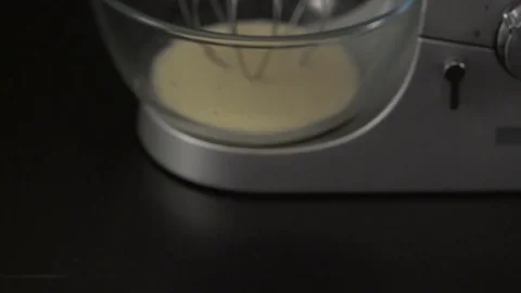 Working kitchen stand mixer with glass bowl on black background Stock Footage 76639731