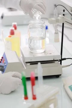 Working in lab with liquids, closeup Stock Photos