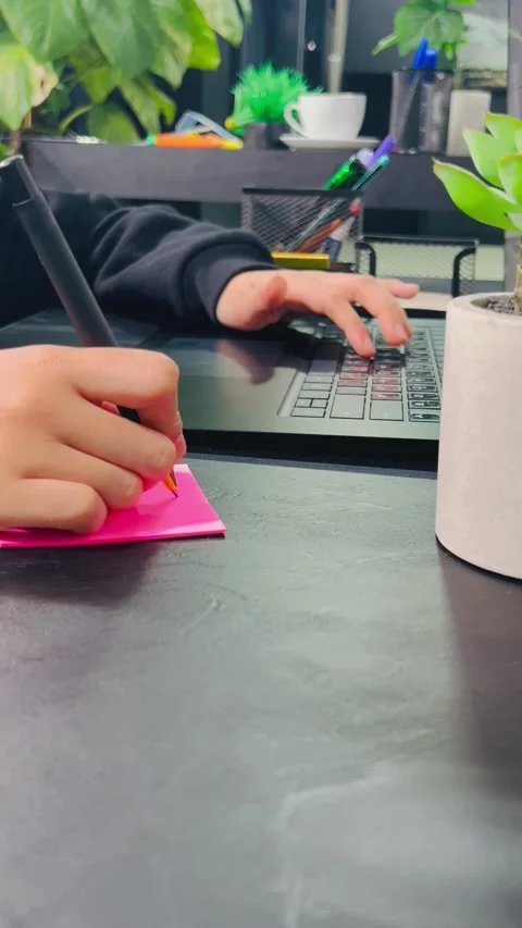 Working on laptop and note-taking, Stock Footage 337710280