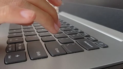 Working on the laptop and typing with the keyboard Stock Footage 150398276