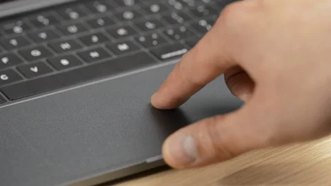 Working on the laptop and using the touchpad Stock-Footage 123541963