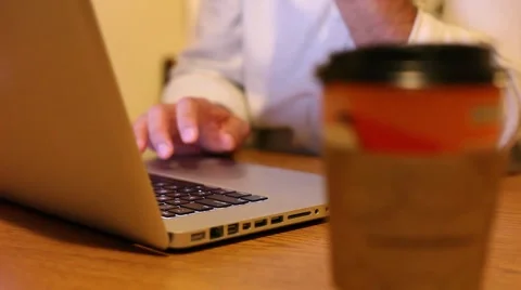 Working on laptop with coffee Stock Footage 5391804