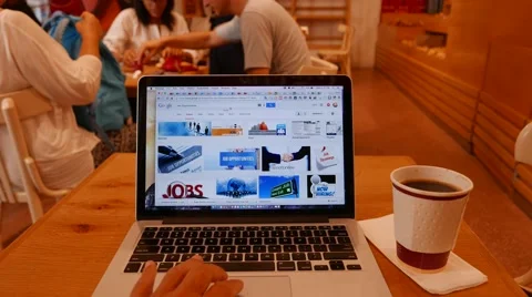 Working on Laptop in Coffee Shop Stock Footage 53447653