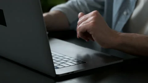 Working on laptop computer, Men's hands typing on keyboard, modern office Stock Footage 144236521