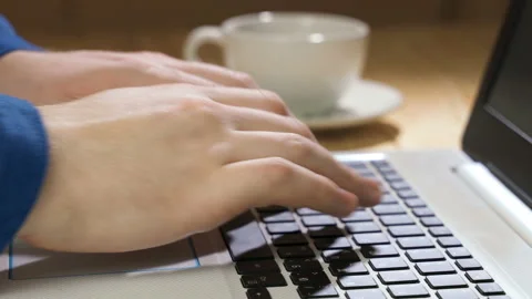 Working on laptop computer, typing on keyboard, modern office business. Men's Stock Footage 105394556
