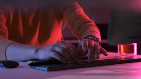 Working on laptop desktop computer, typing on keyboard, neon office Stock-Footage 126643311