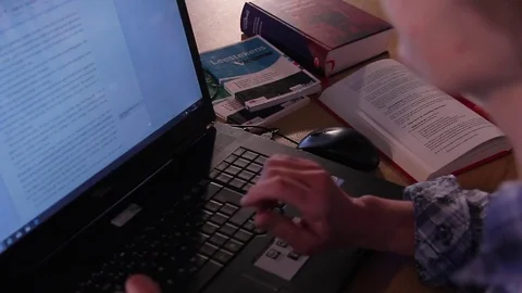 Working on a laptop Video stock 72510276