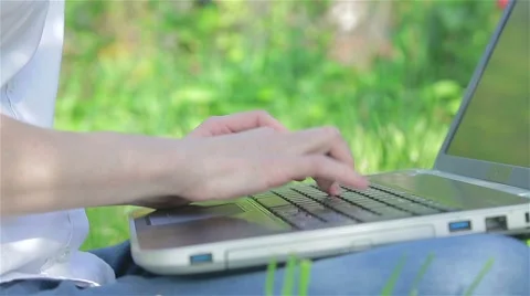 Working on the laptop in the garden Stock Footage 50721639