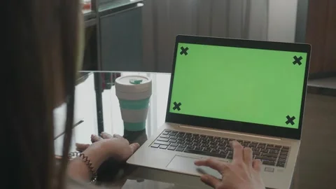 Working on a Laptop with a Green Screen Background Video stock 315976616