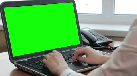 Working on laptop with green screen Stock Footage 56495319