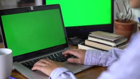 Working on a laptop with green screen Video stock 80317727