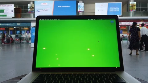 Working on a laptop with green screen on table in the airpor Stock Footage 108311759