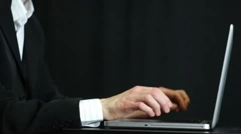 Working on laptop low key Stock Footage 21817954